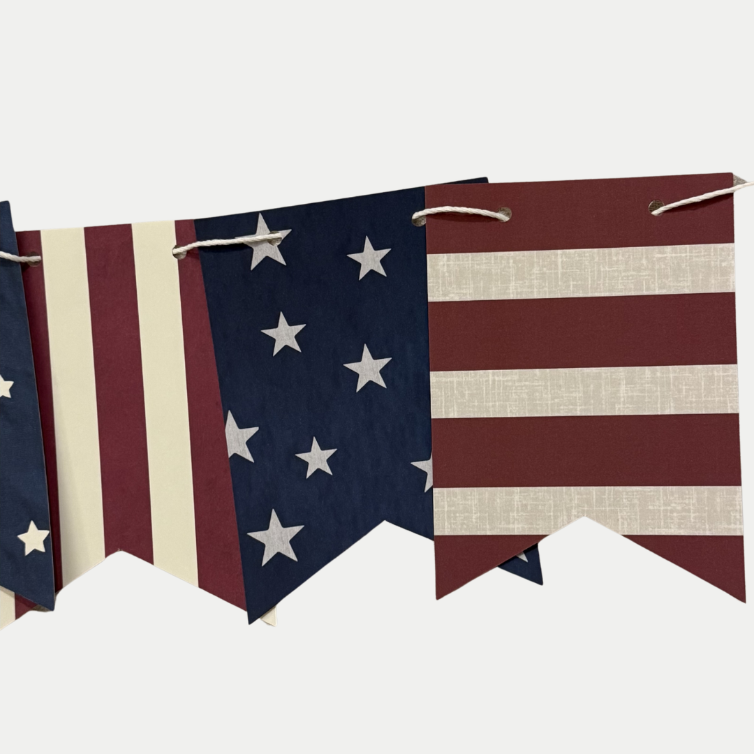 American flag-themed bunting with stars and stripes on a white background