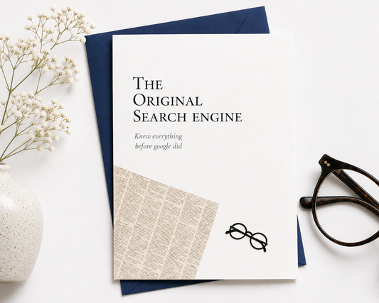 Notebook with 'The Original Search Engine' text on a white surface with decorative items.